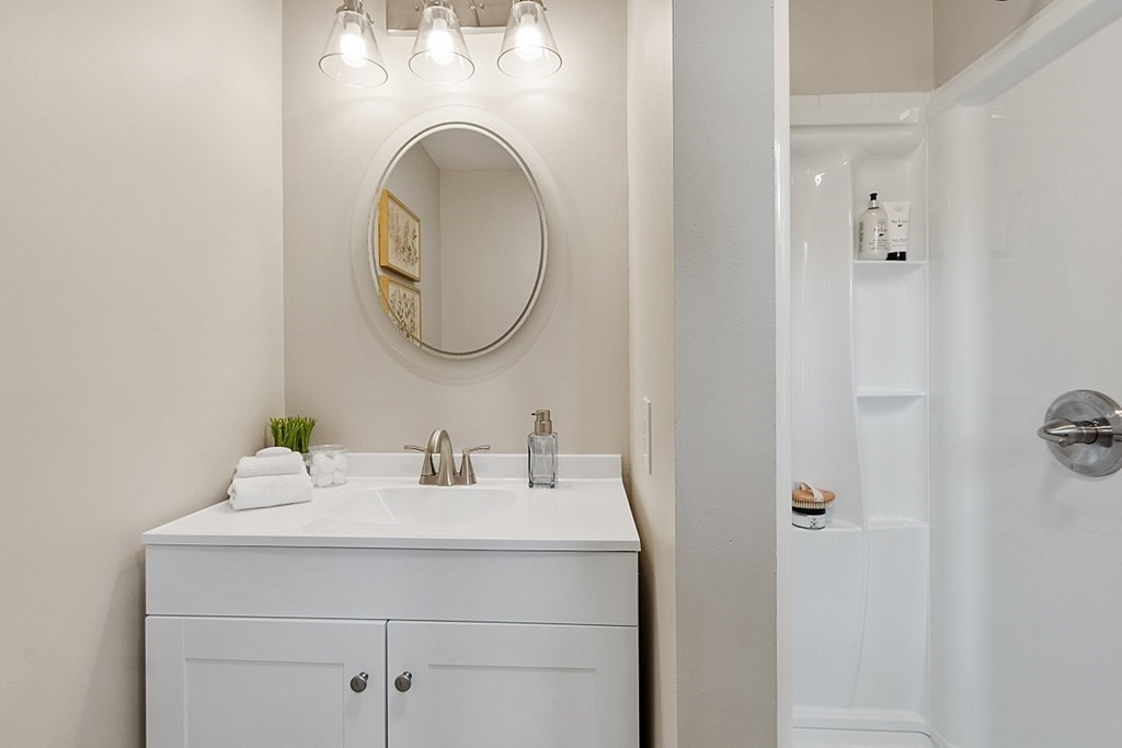 43 R Beaver Brook Road Westford, MA 01886 - Photo 21 of 42 a bathroom with a sink and a mirror
