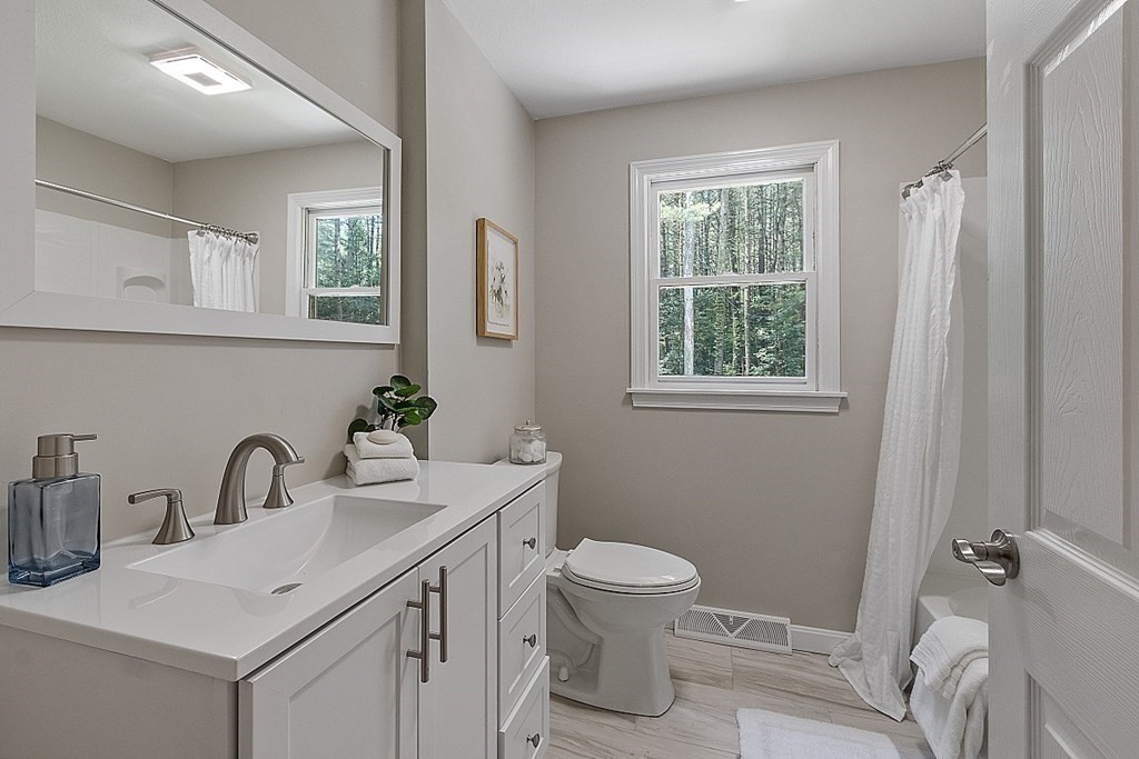 43 R Beaver Brook Road Westford, MA 01886 - Photo 28 of 42 a bathroom with a sink toilet and a window