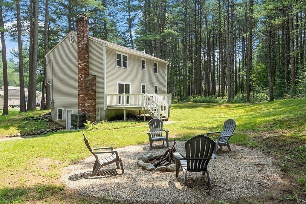 43 R Beaver Brook Road Westford, MA 01886 - Photo 33 of 42 a view of a house with backyard and sitting area