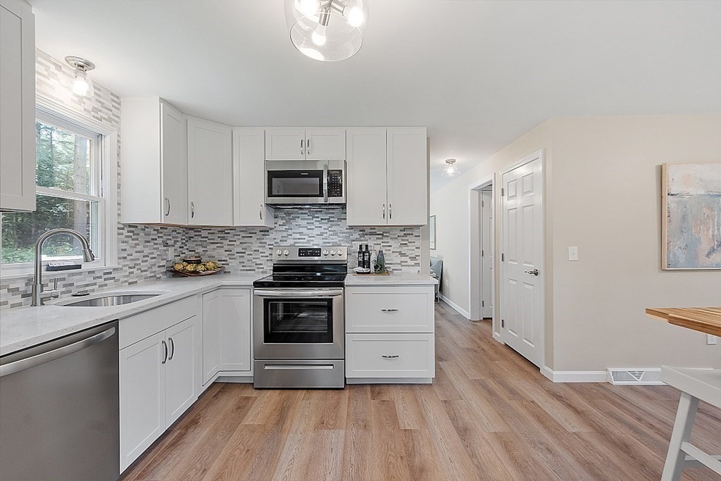 43 R Beaver Brook Road Westford, MA 01886 - Photo 8 of 42 a kitchen with stainless steel appliances a white cabinets and sink