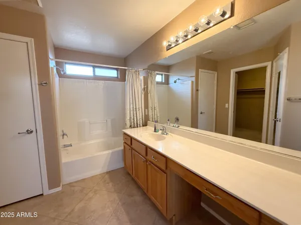 a bathroom with a bathtub and a sink