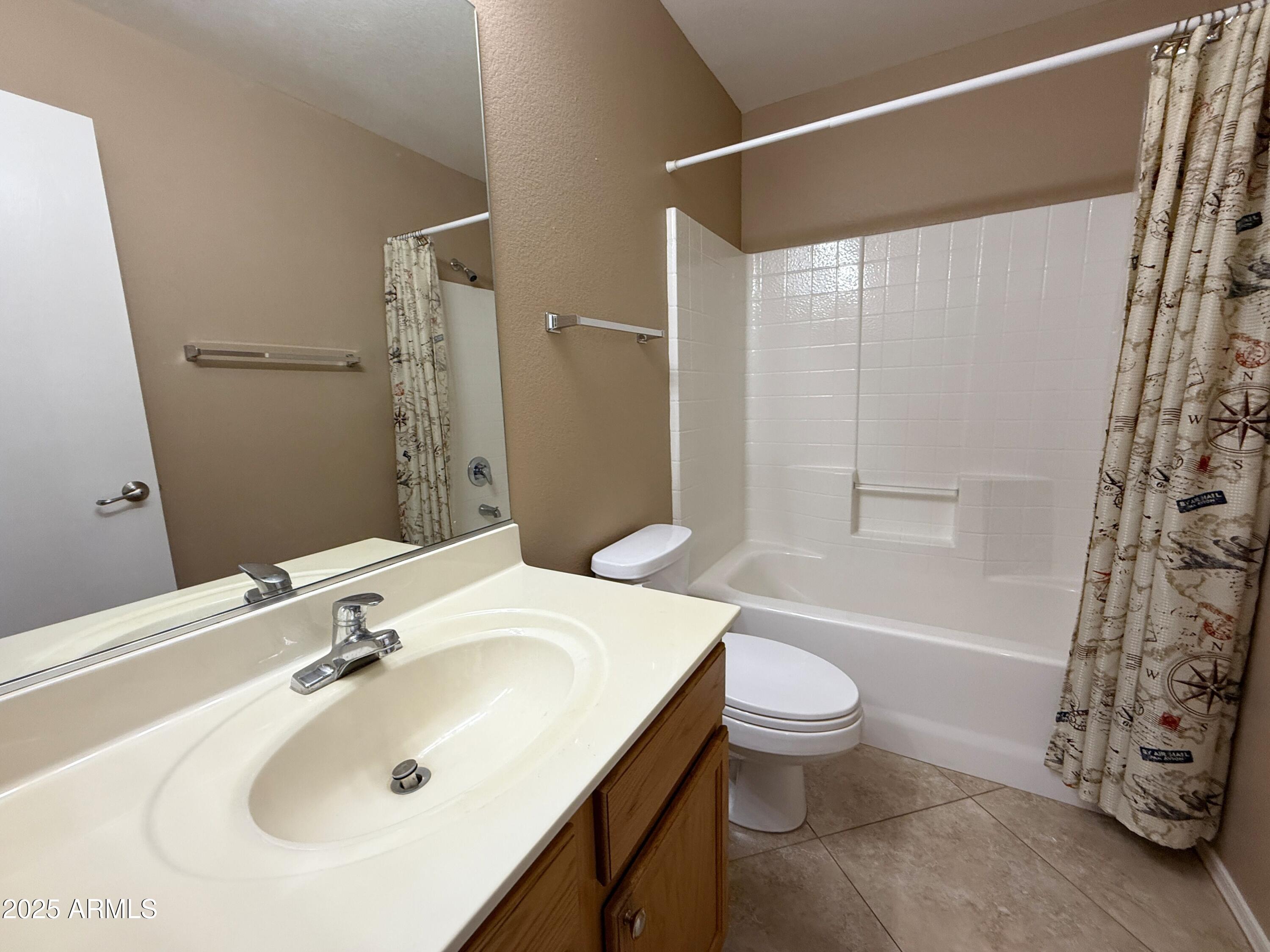 3838 East Derringer Way Gilbert, AZ 85297 - Photo 20 of 24 a bathroom with a sink toilet and shower