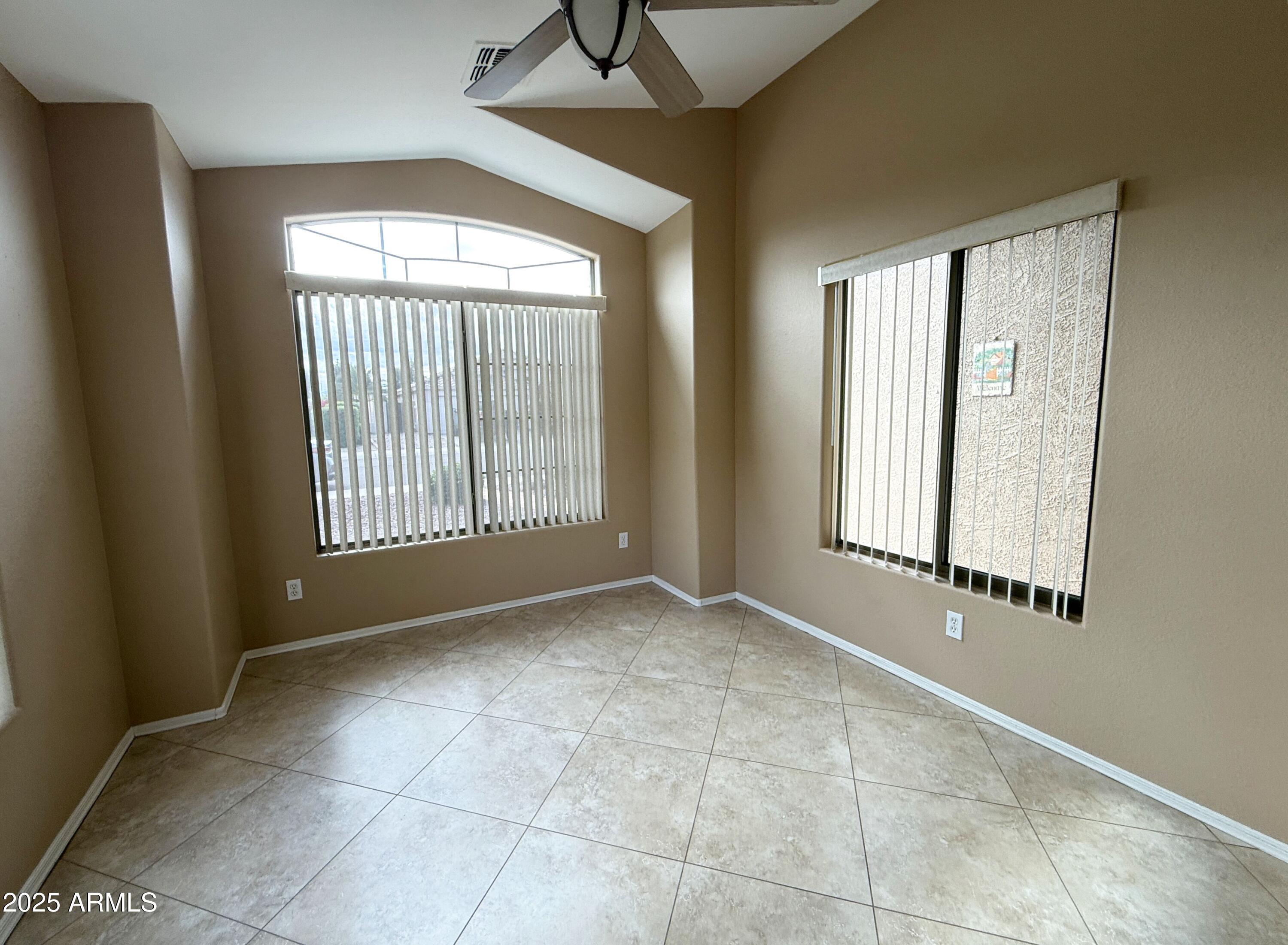 3838 East Derringer Way Gilbert, AZ 85297 - Photo 9 of 24 a view of an empty room with a window