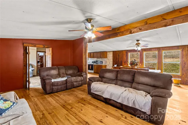 a view of a livingroom with furniture and a fireplace