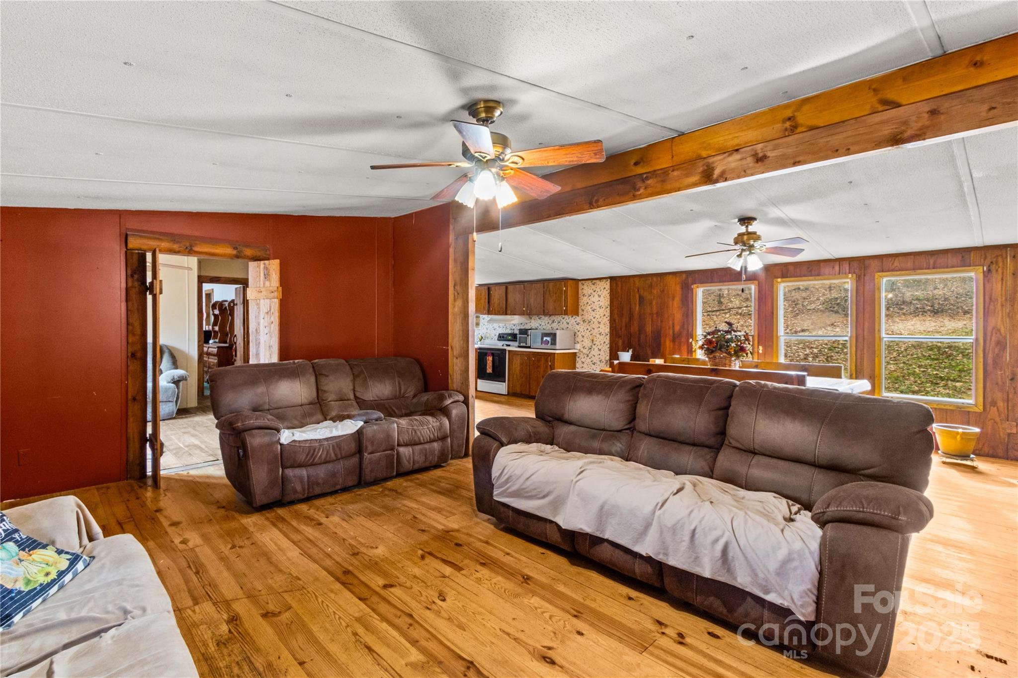 338 Piney Grove Road Harmony, NC 28634 - Photo 15 of 44 a living room with furniture a ceiling fan and a rug