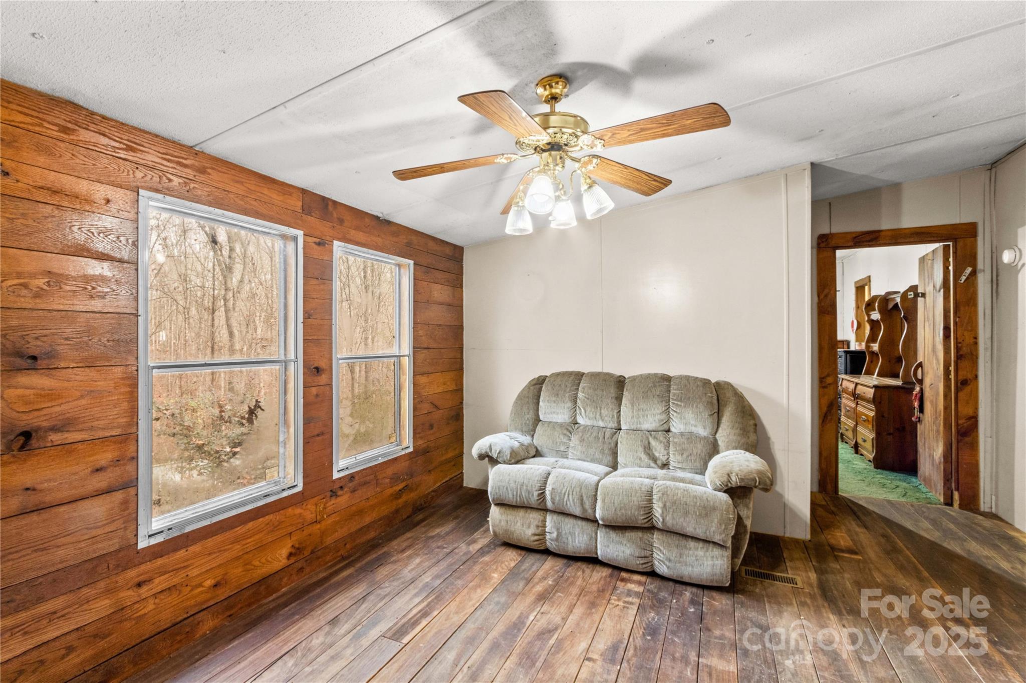 338 Piney Grove Road Harmony, NC 28634 - Photo 17 of 44 a living room with furniture and a large window