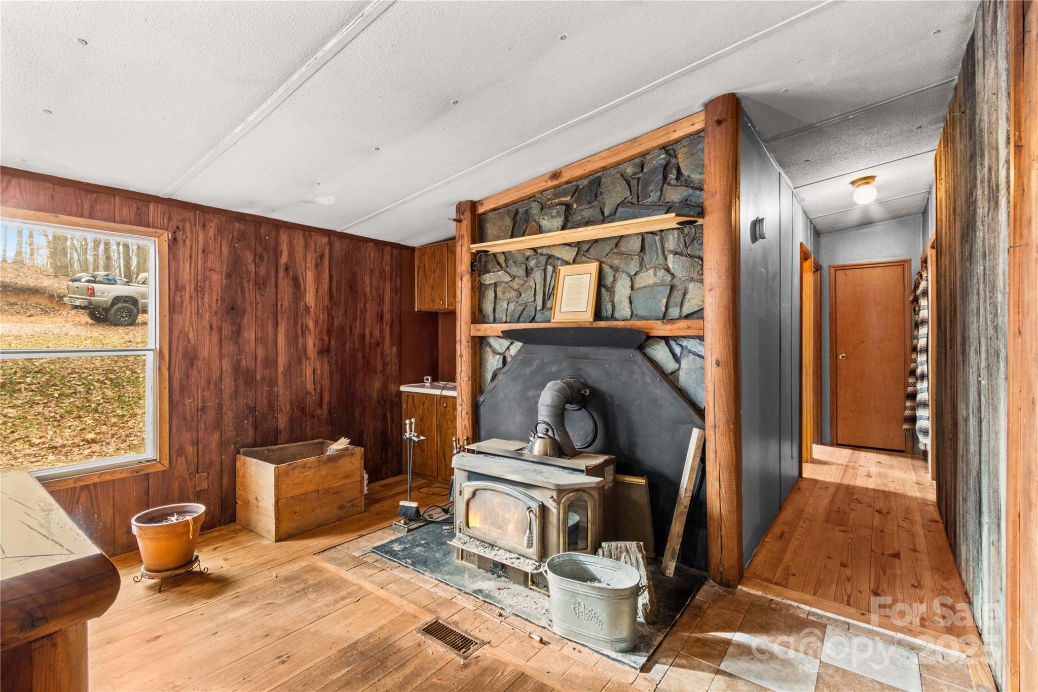338 Piney Grove Road Harmony, NC 28634 - Photo 20 of 44 a view of a livingroom with furniture and a fireplace