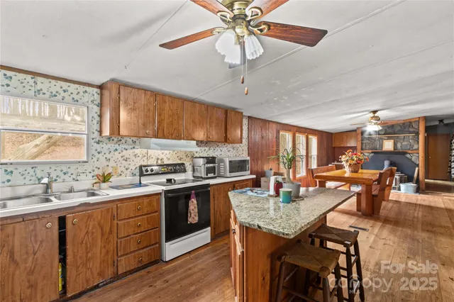 a view of an empty room with a fan