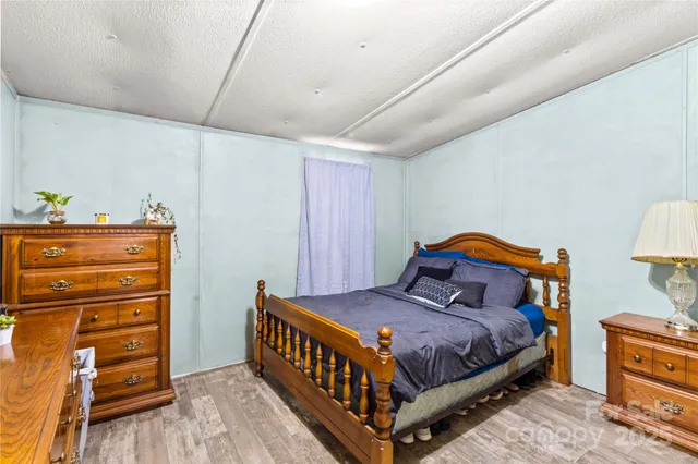 a bedroom with a bed and a cabinets