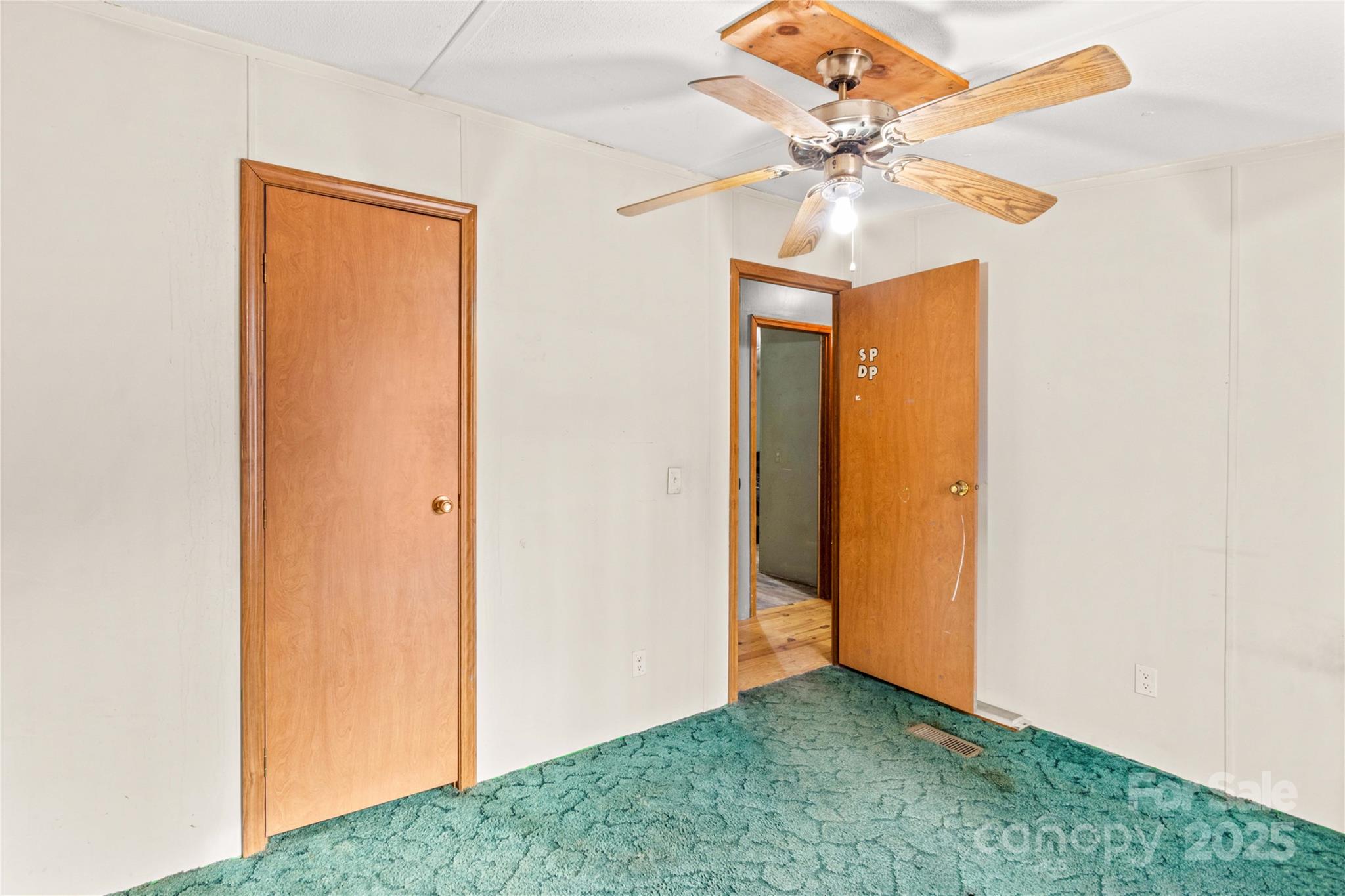 338 Piney Grove Road Harmony, NC 28634 - Photo 30 of 44 a view of an empty room with a fan
