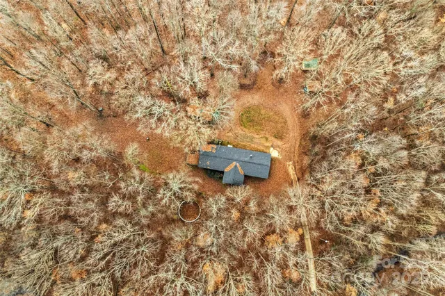 a wooden fence with some trees