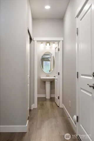 a view of a hallway with washer and dryer