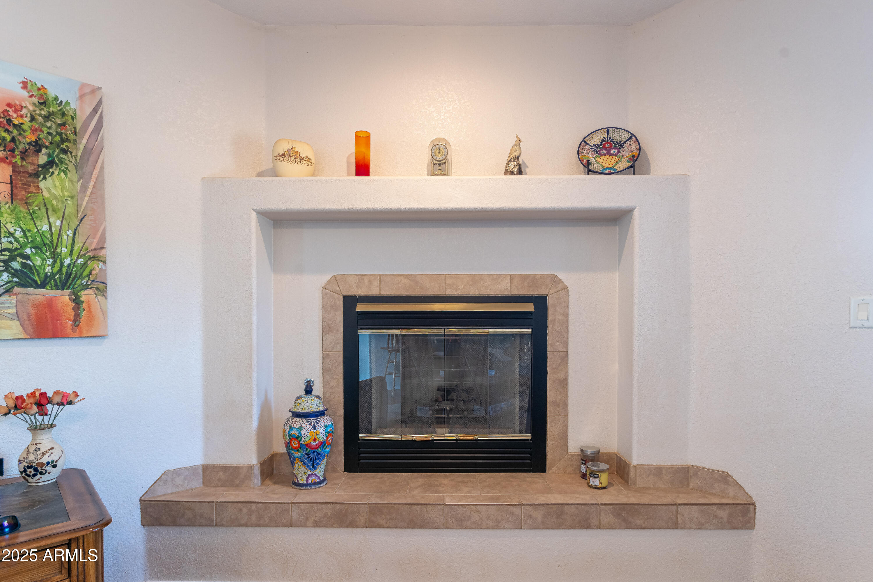 7072 South Ridling Drive Hereford, AZ 85615 - Photo 18 of 69 a living room with a fireplace and potted plant
