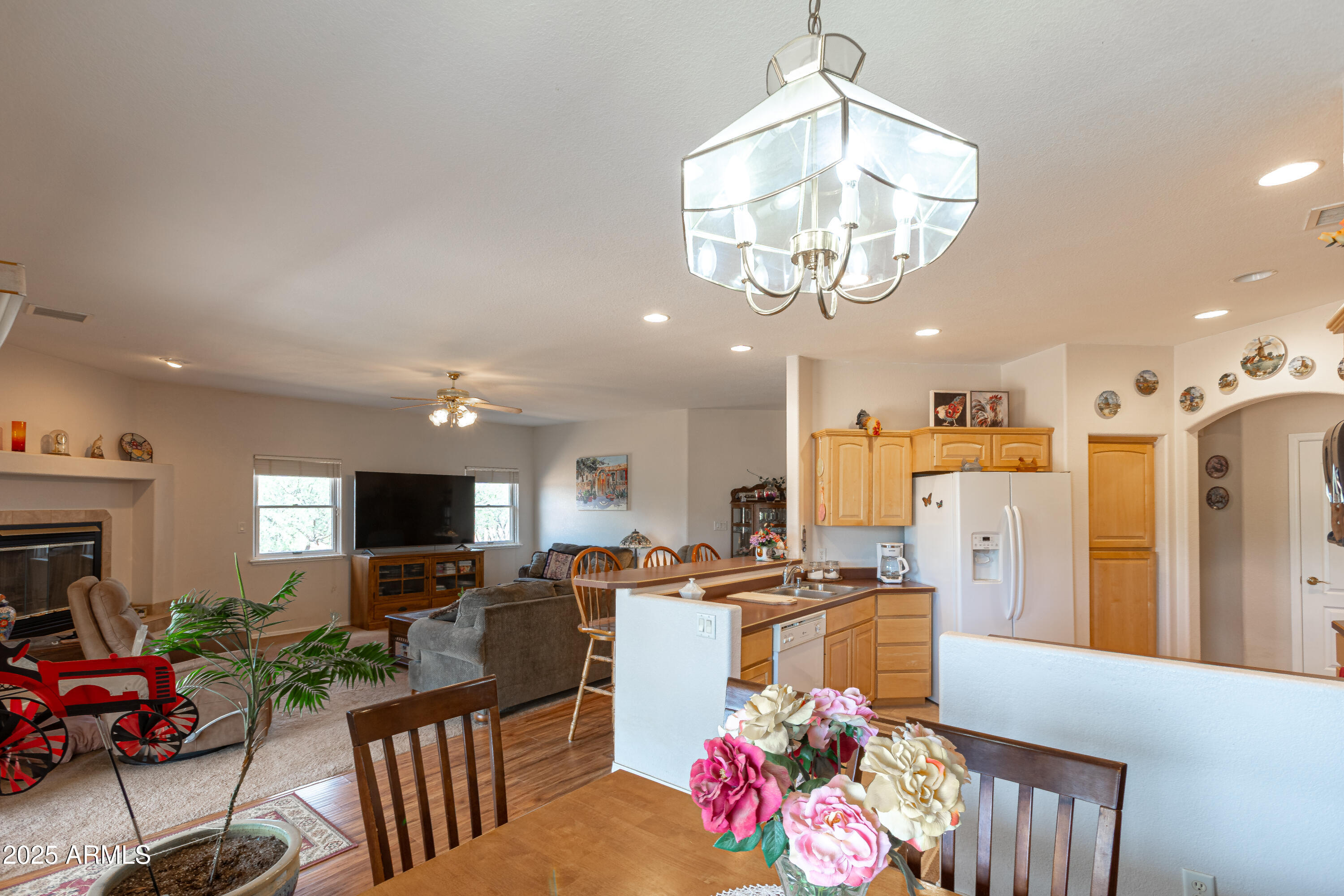 7072 South Ridling Drive Hereford, AZ 85615 - Photo 19 of 69 a kitchen with stainless steel appliances kitchen island granite countertop a refrigerator stove top oven and sink