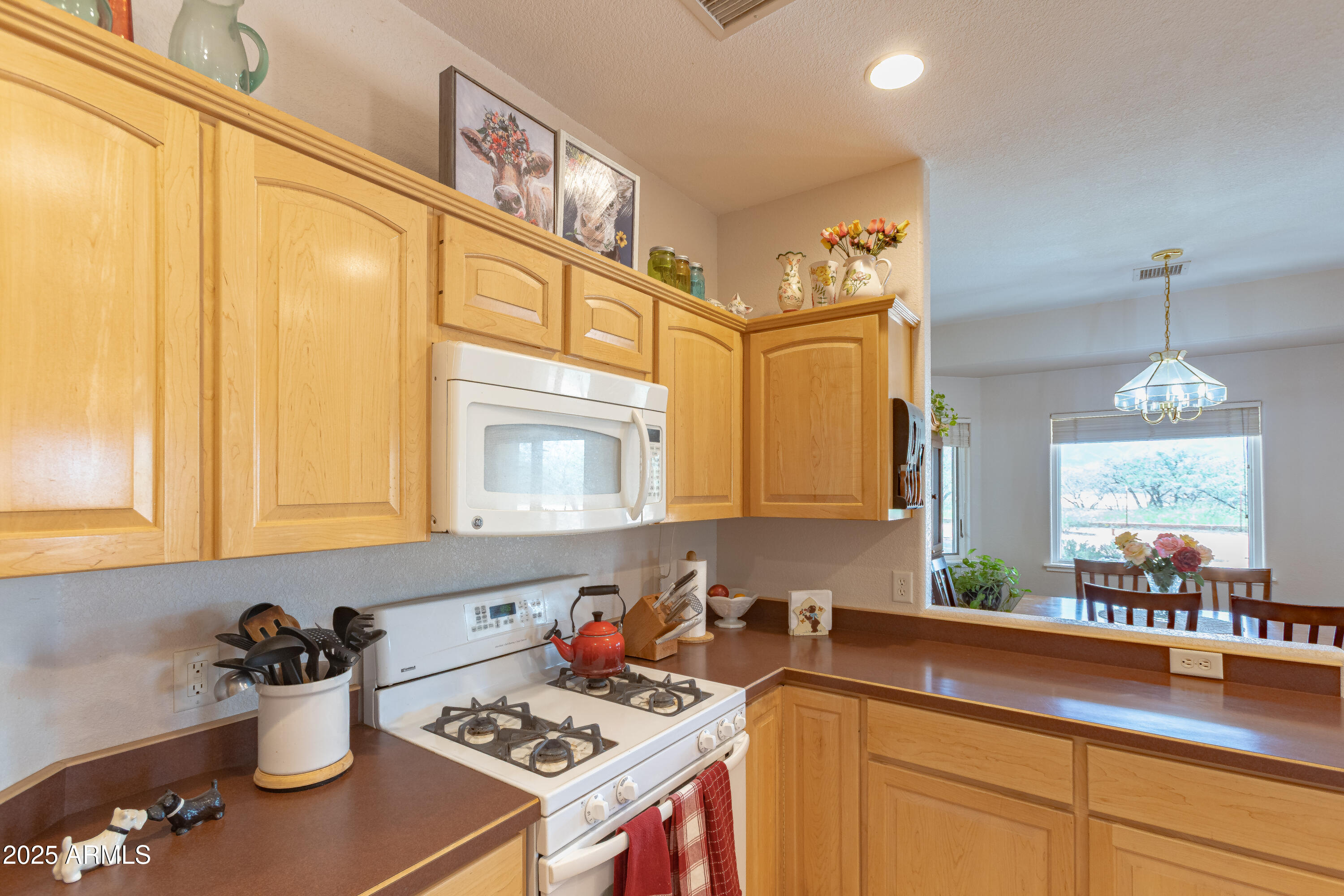 7072 South Ridling Drive Hereford, AZ 85615 - Photo 24 of 69 a kitchen with a sink and a stove top oven