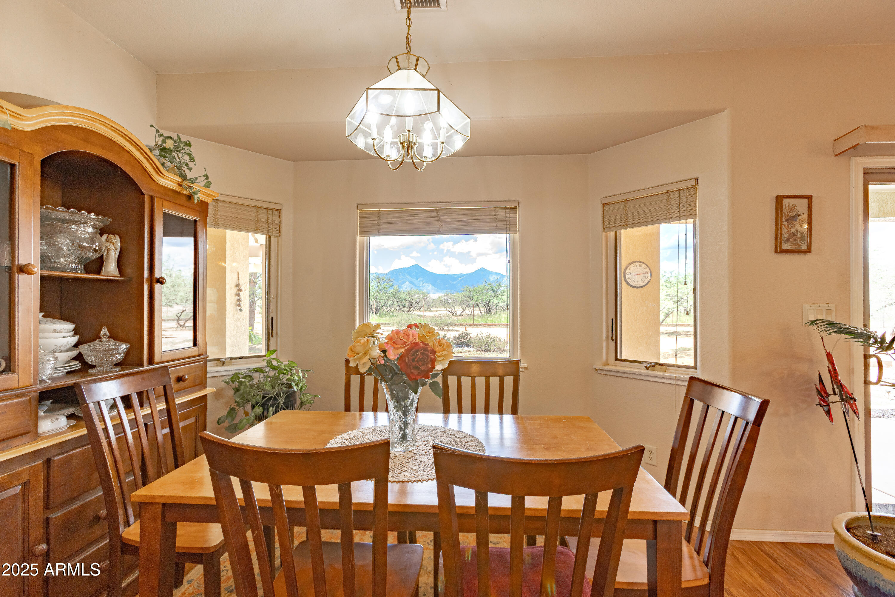 7072 South Ridling Drive Hereford, AZ 85615 - Photo 28 of 69 a view of a dining room with furniture wooden floor and chandelier