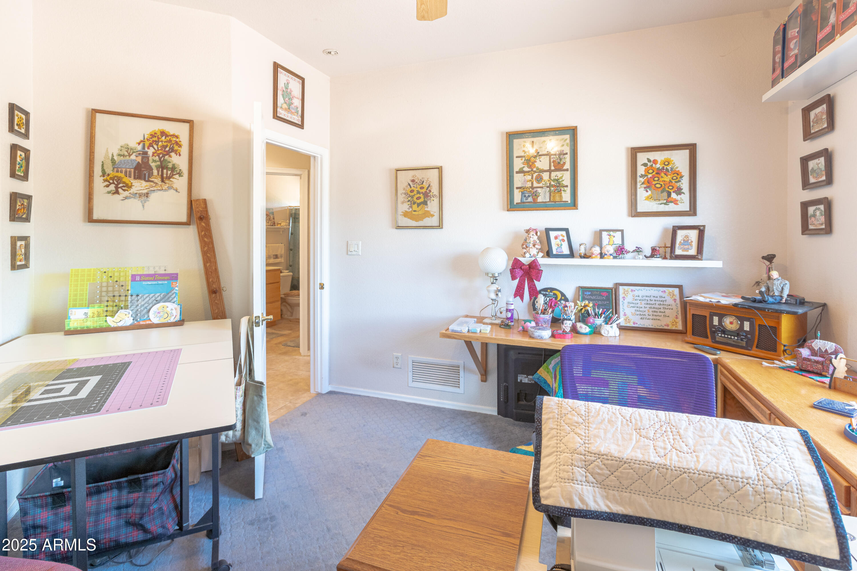 7072 South Ridling Drive Hereford, AZ 85615 - Photo 35 of 69 a living room with furniture and paintings on the wall