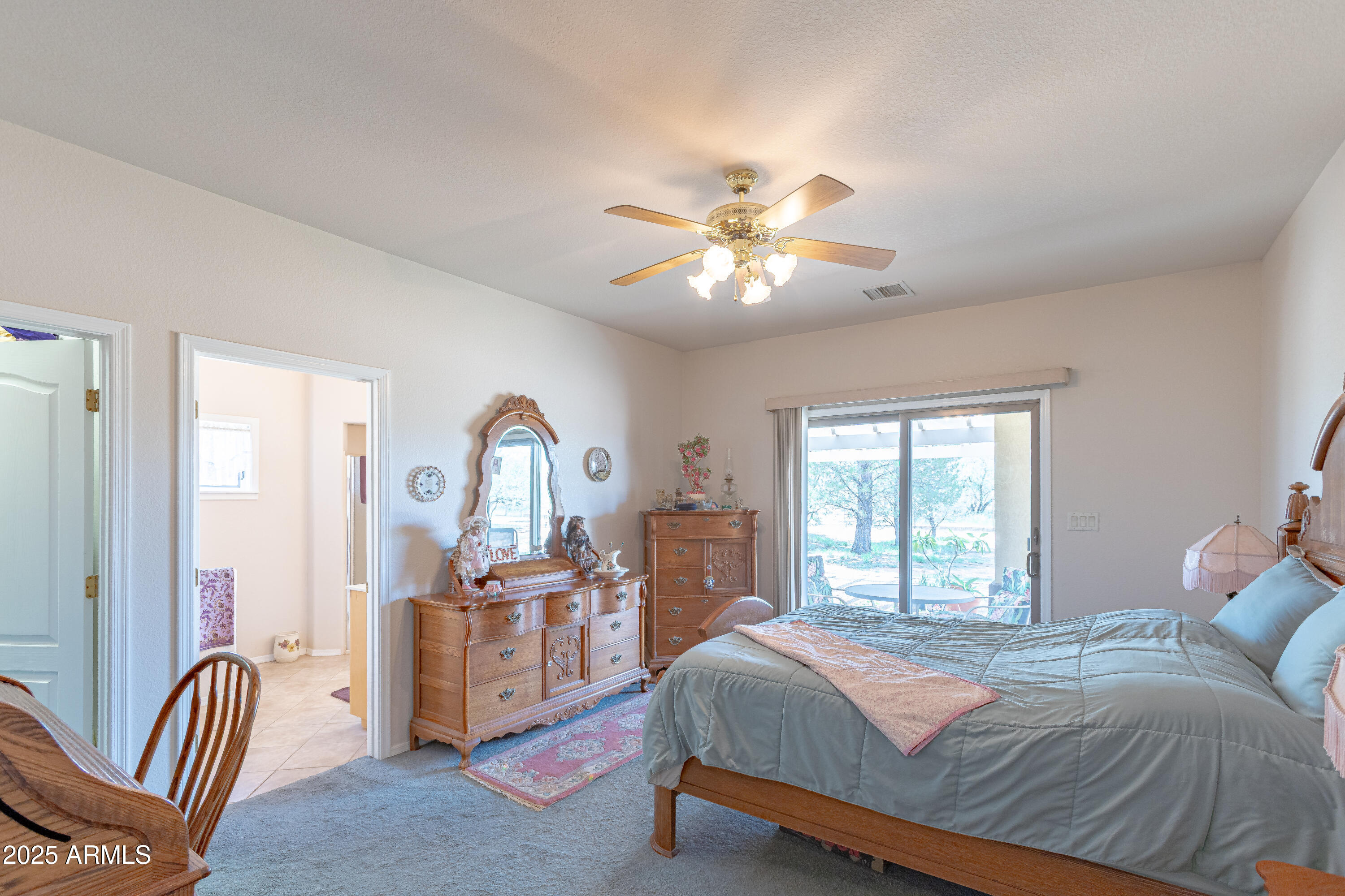 7072 South Ridling Drive Hereford, AZ 85615 - Photo 36 of 69 a bedroom with a bed and a chandelier