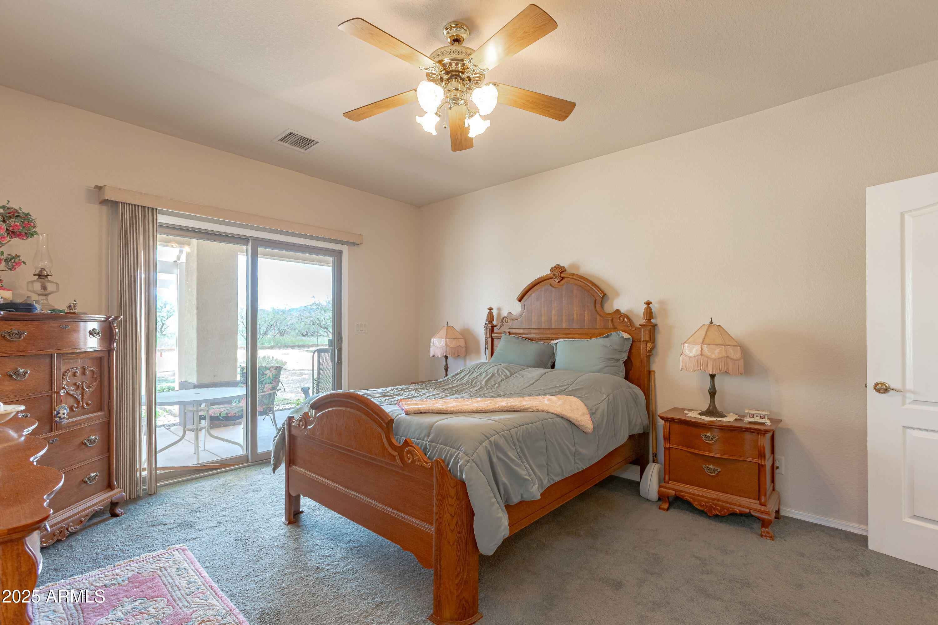 7072 South Ridling Drive Hereford, AZ 85615 - Photo 37 of 69 a bedroom with a bed and a chandelier