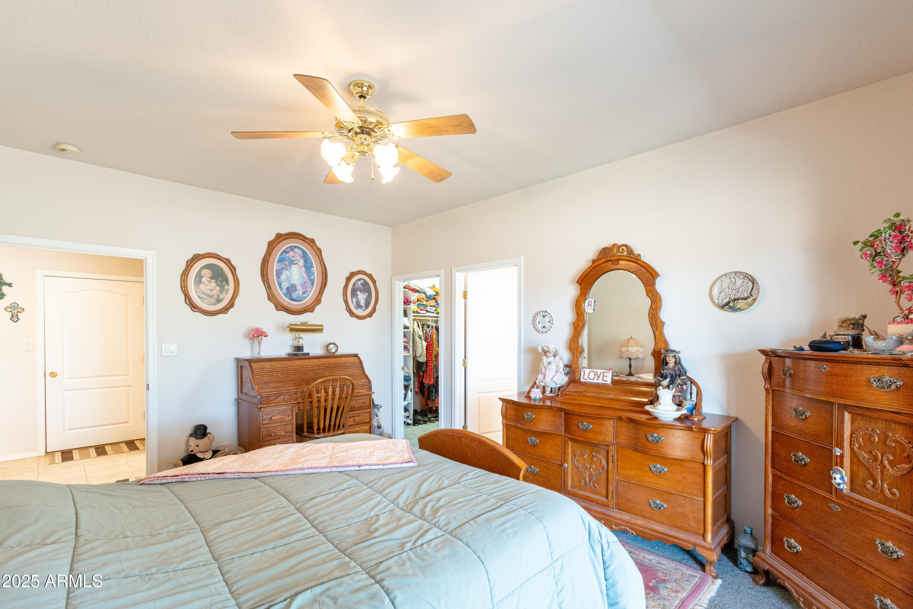 7072 South Ridling Drive Hereford, AZ 85615 - Photo 38 of 69 a bedroom with a bed and a chandelier