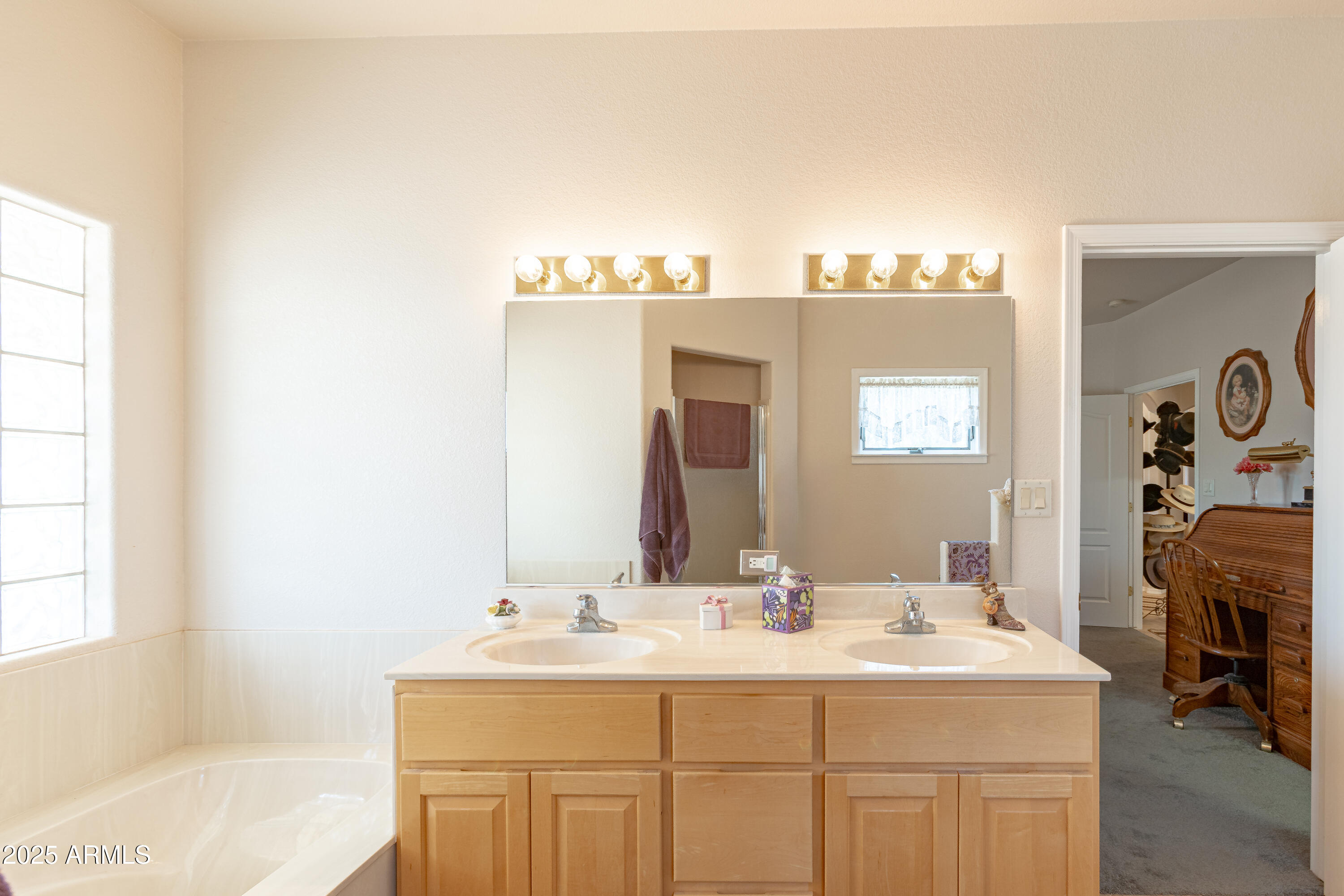 7072 South Ridling Drive Hereford, AZ 85615 - Photo 41 of 69 a bathroom with a sink and a mirror