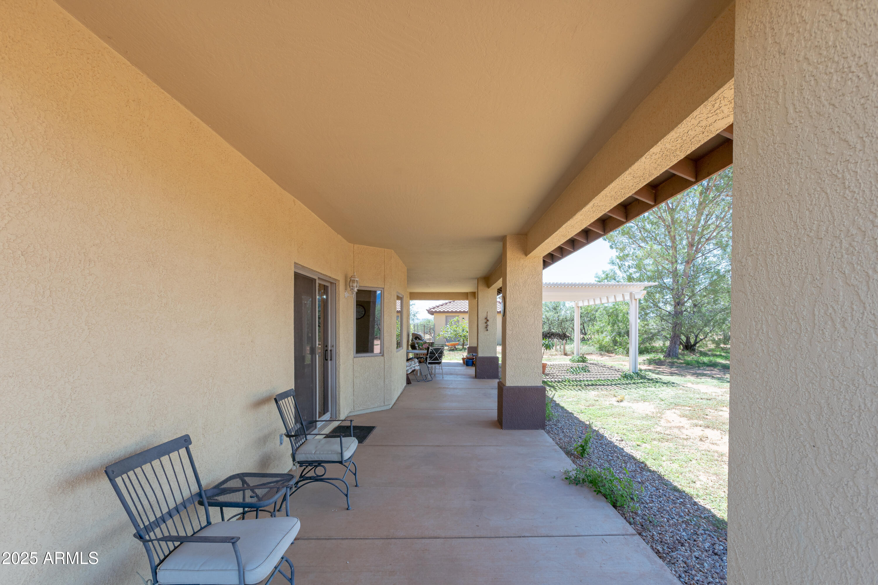 7072 South Ridling Drive Hereford, AZ 85615 - Photo 45 of 69 a view of living room with furniture and floor to ceiling window