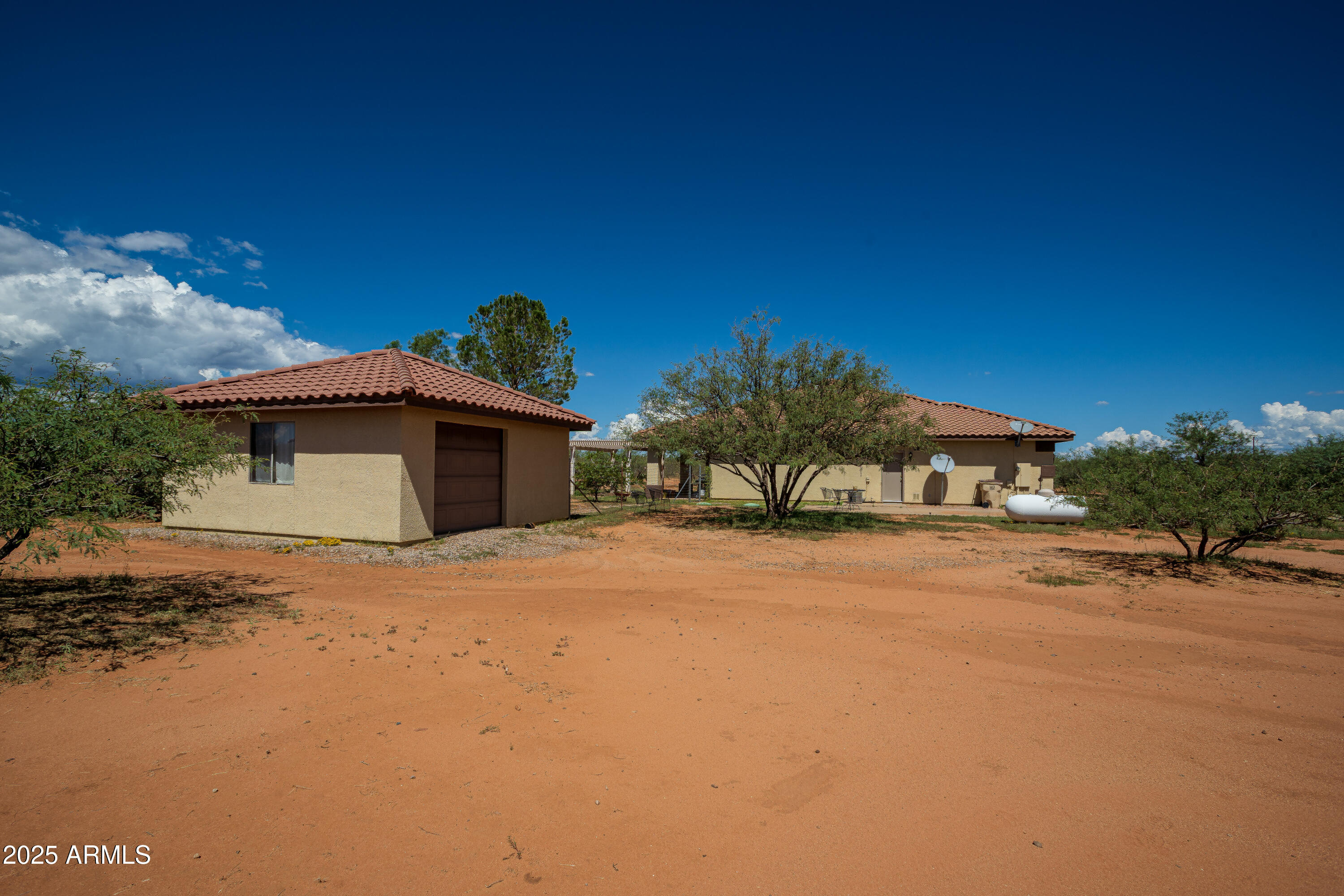 7072 South Ridling Drive Hereford, AZ 85615 - Photo 6 of 69 a front view of a house with a yard and garage