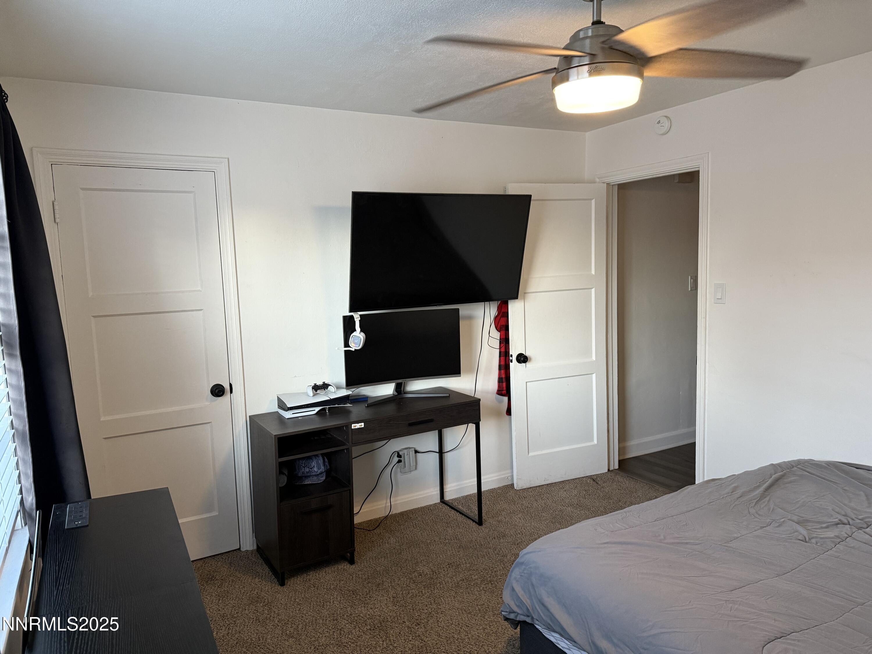 345 H Street Sparks, NV 89431 - Photo 14 of 14 a bedroom with a bed and a flat screen tv
