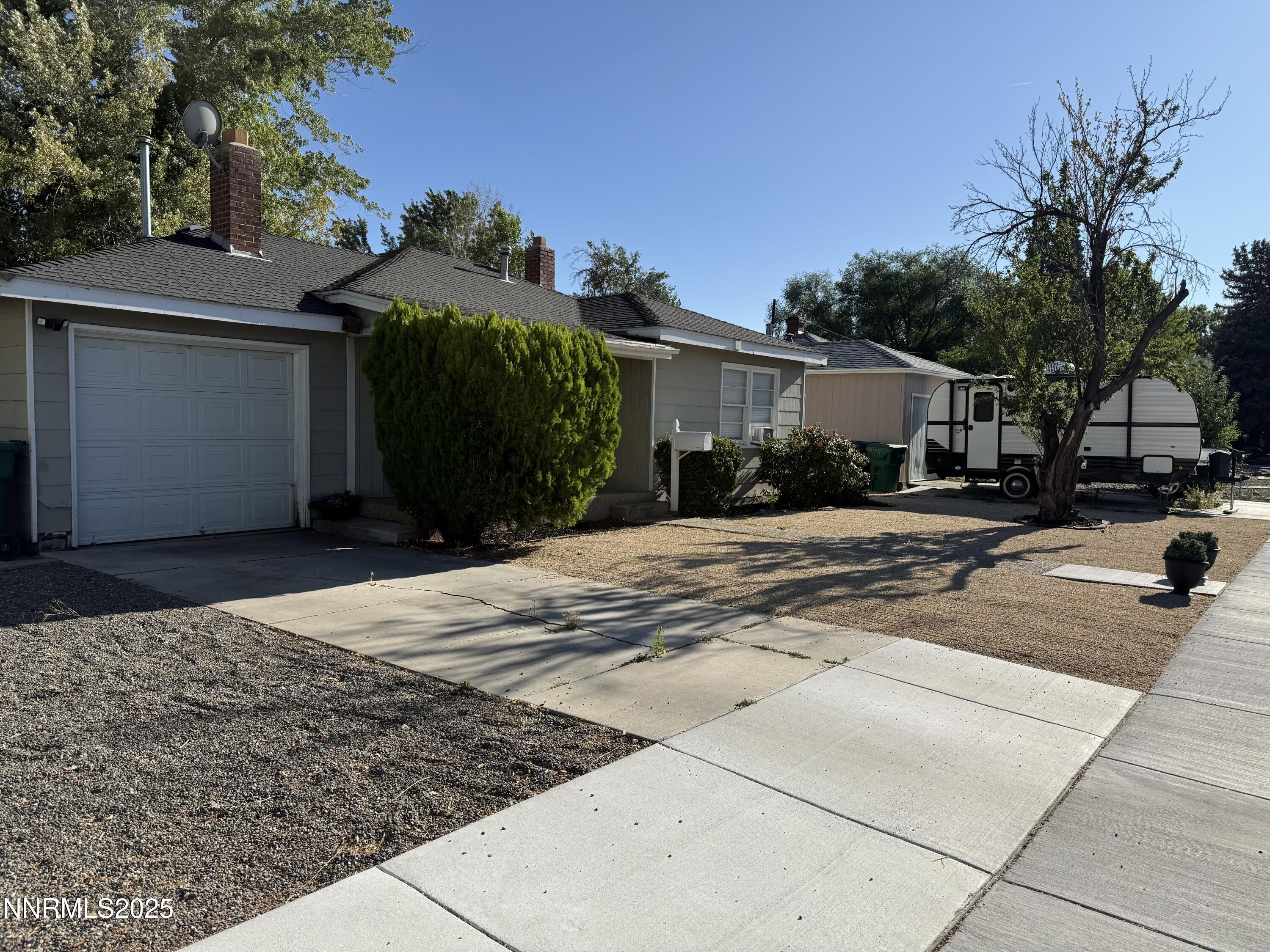 345 H Street Sparks, NV 89431 - Photo 2 of 14 a view of a car park in front of house