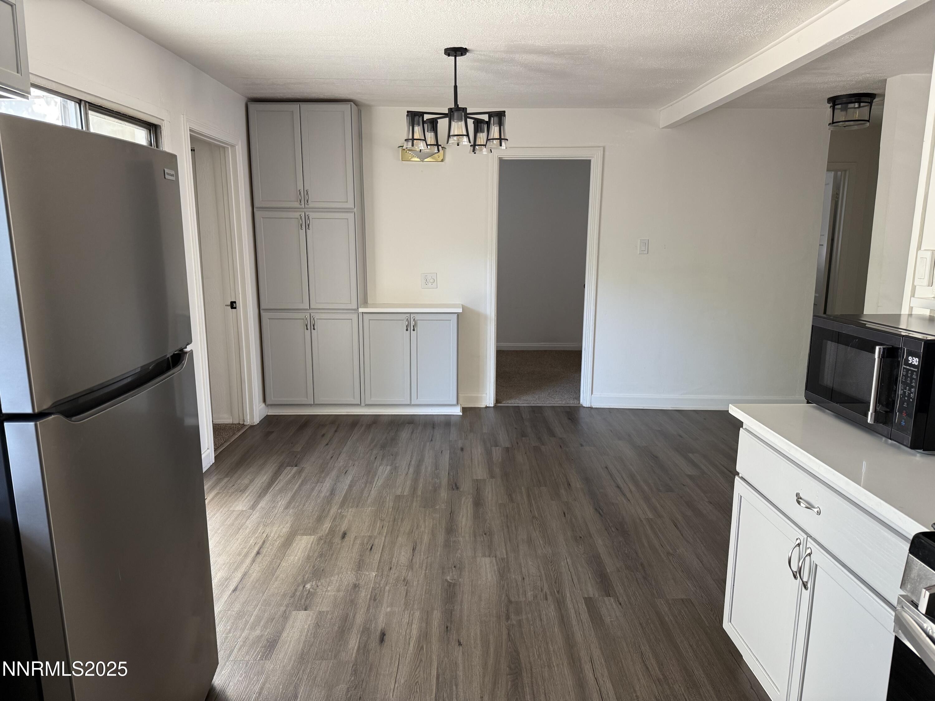 345 H Street Sparks, NV 89431 - Photo 5 of 14 a kitchen with a refrigerator and a stove top oven