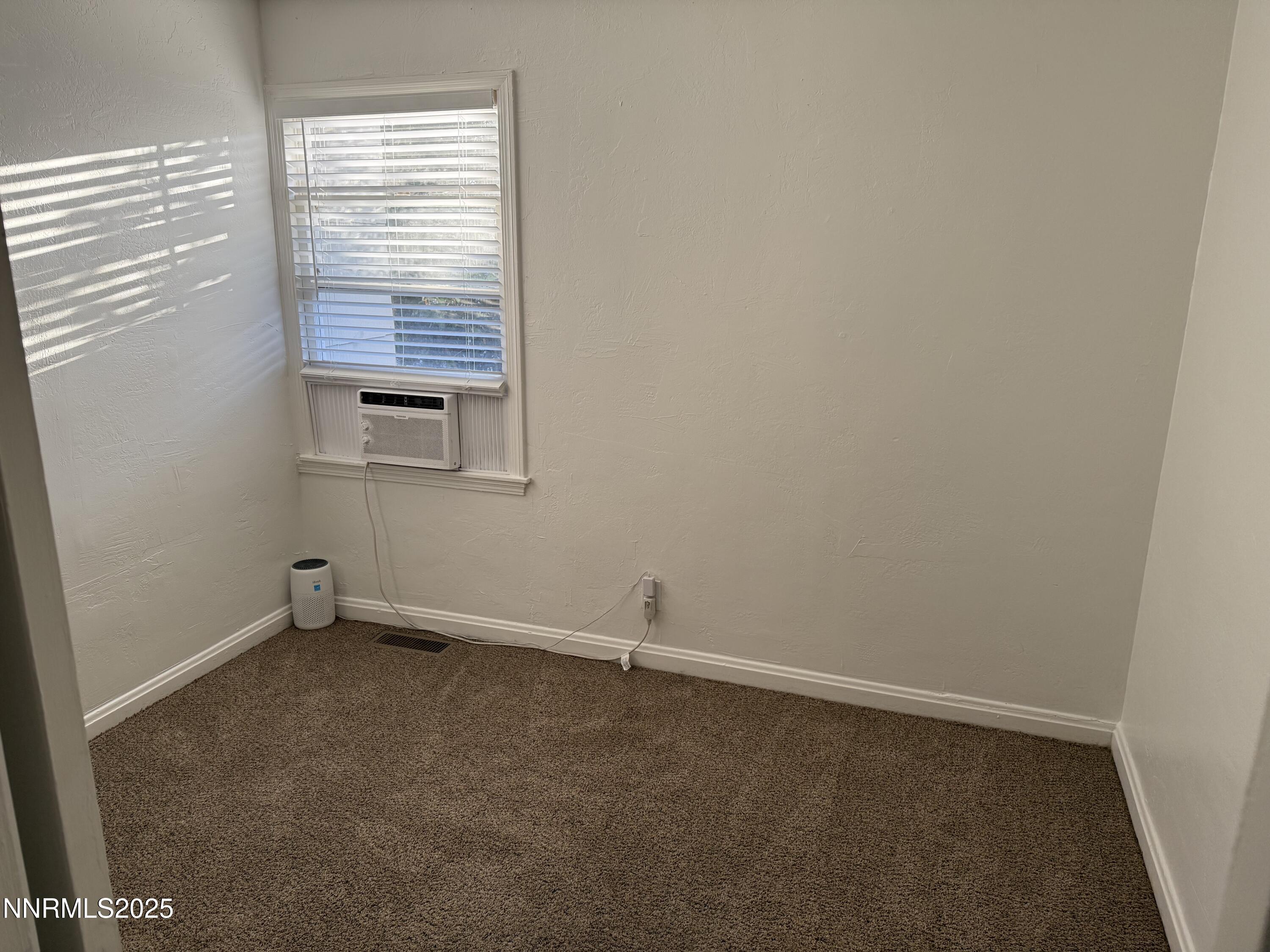 345 H Street Sparks, NV 89431 - Photo 10 of 14 an empty room with a window