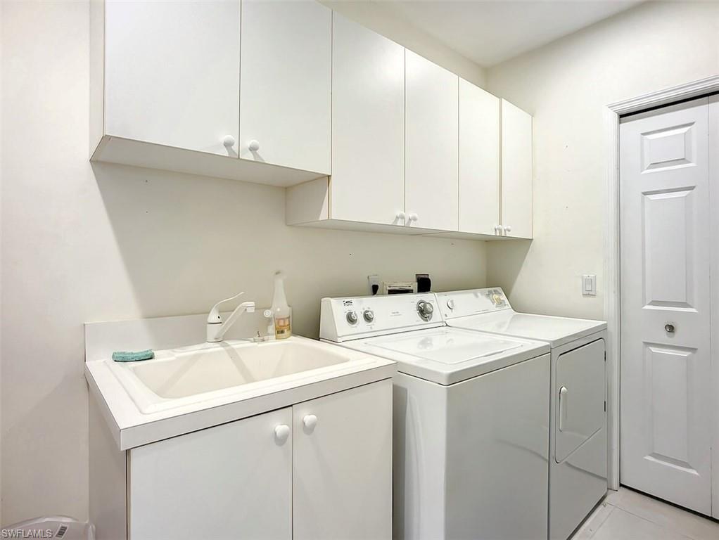 14530 Red Fox Run, Unit 215 Naples, FL 34110 - Photo 17 of 28 a utility room with dryer and washer