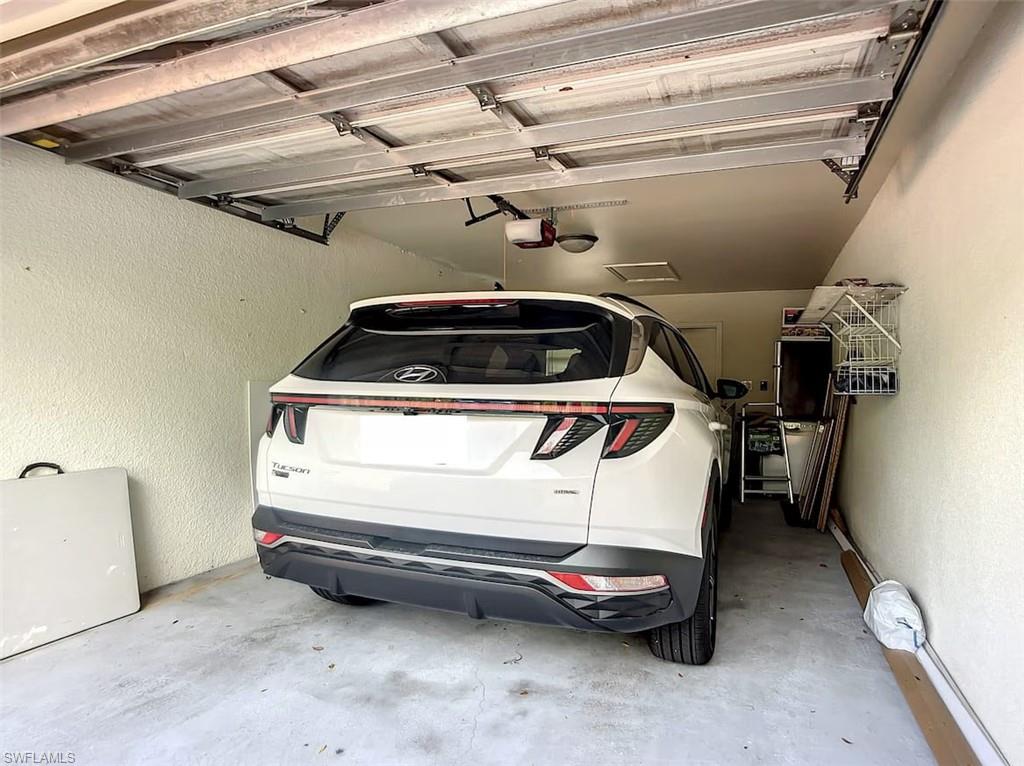 14530 Red Fox Run, Unit 215 Naples, FL 34110 - Photo 18 of 28 a utility room with dryer and washer