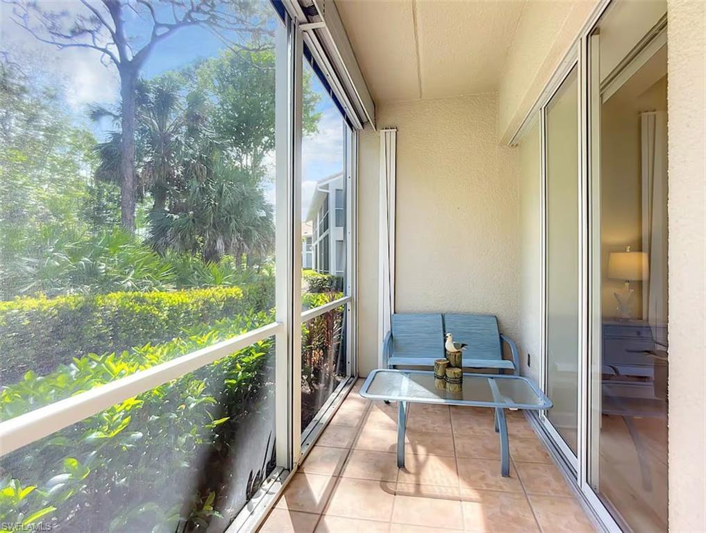 14530 Red Fox Run, Unit 215 Naples, FL 34110 - Photo 19 of 28 a house view with a outdoor space