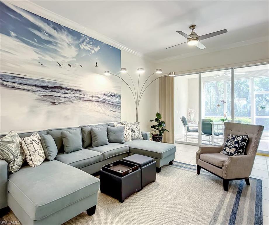 14530 Red Fox Run, Unit 215 Naples, FL 34110 - Photo 2 of 28 a living room with furniture and a large window
