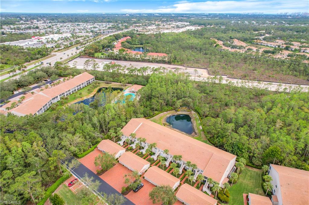14530 Red Fox Run, Unit 215 Naples, FL 34110 - Photo 26 of 28 an aerial view of residential houses with outdoor space
