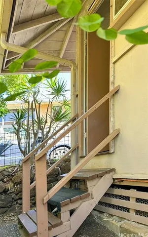 a blue and white umbrella sitting in front of a building