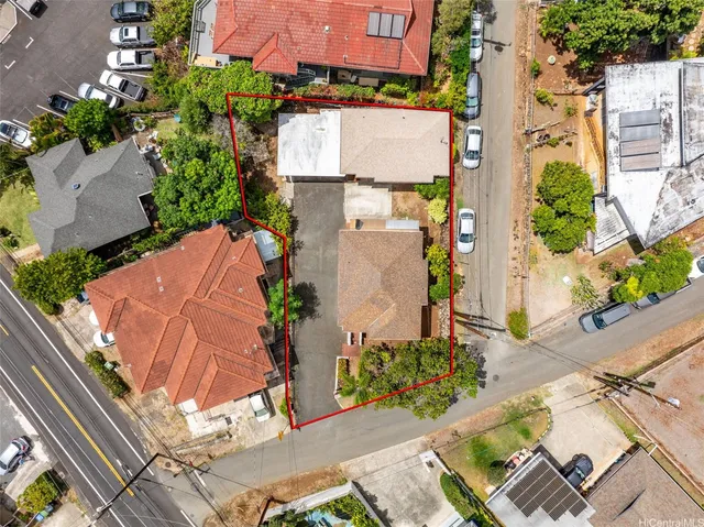 an aerial view of residential houses with outdoor space