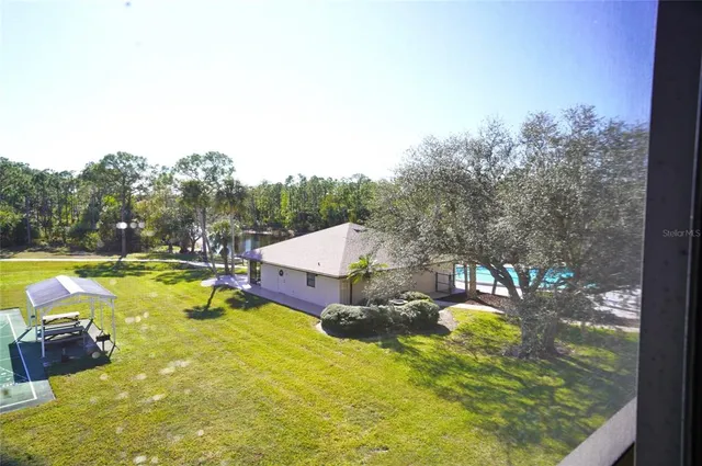a swimming pool with some trees in the background