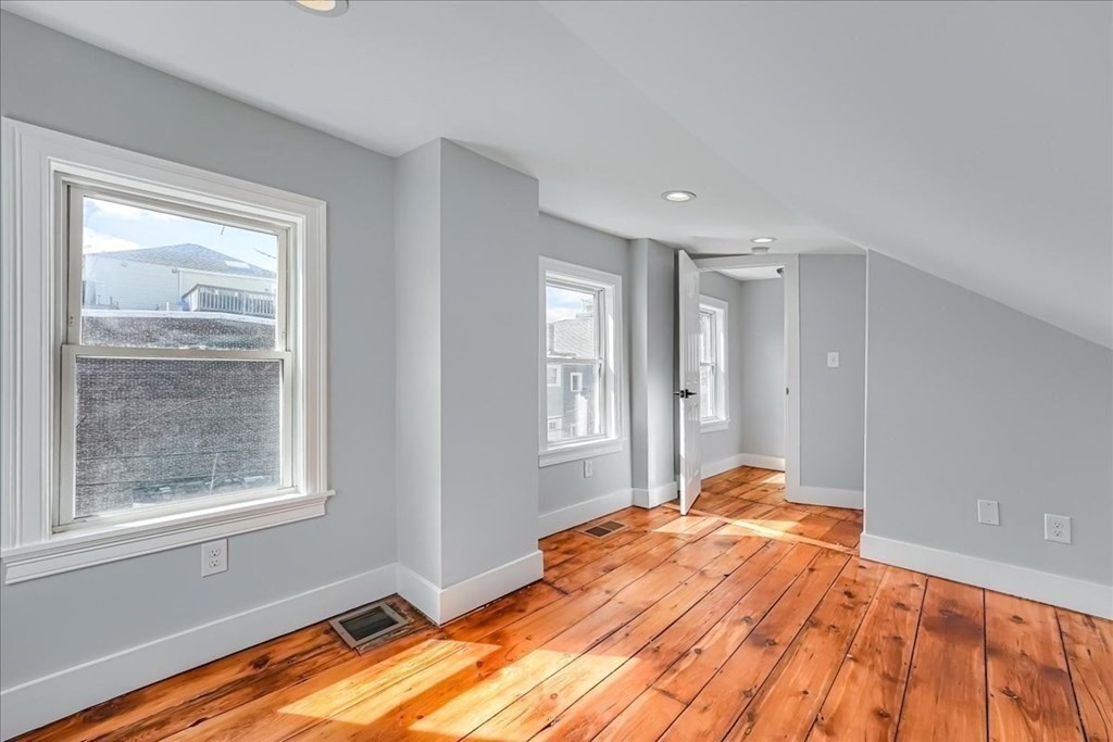 1 Short St Place Boston, MA 02129 - Photo 16 of 21 a bedroom with a bed and a window
