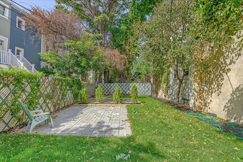 1 Short St Place Boston, MA 02129 - Photo 18 of 21 a view of a backyard with plants and large trees