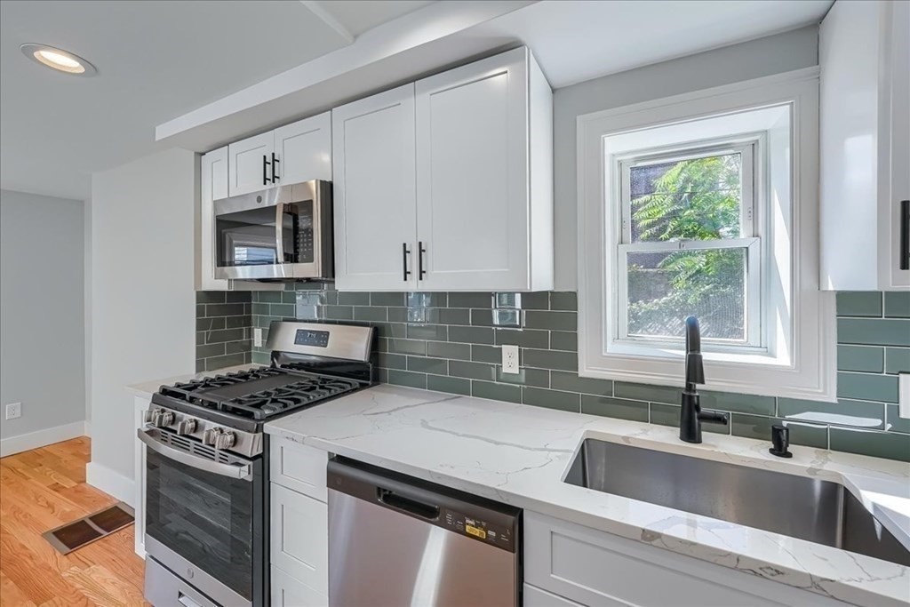 1 Short St Place Boston, MA 02129 - Photo 6 of 21 a kitchen that has a sink and a stove