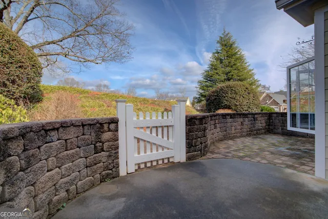 a view of a wooden house with a street