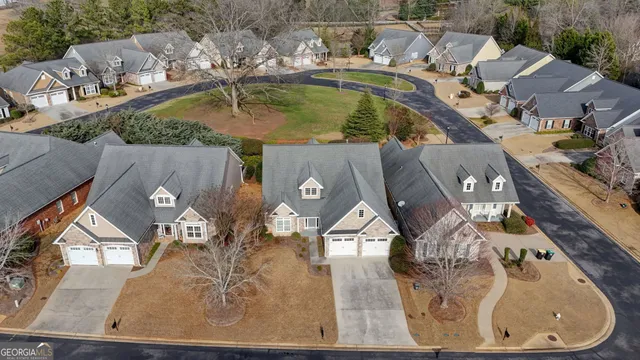an aerial view of a house with a swimming pool