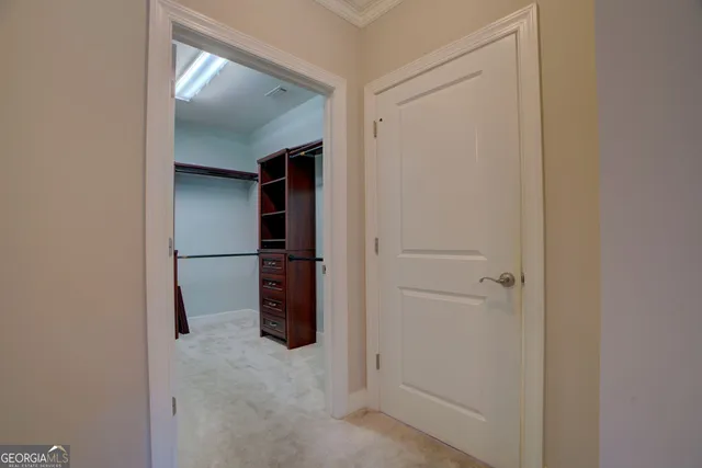 a spacious bathroom with a granite countertop sink a mirror and a shower