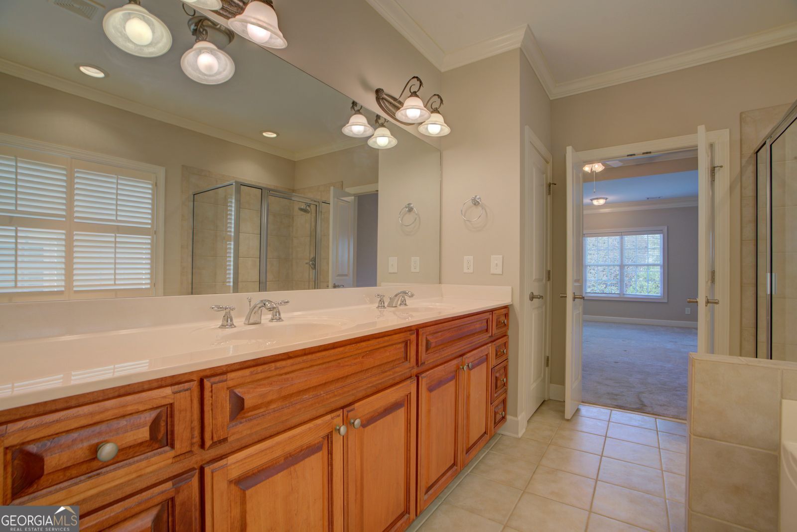 115 Carriage Way Southeast Rome, GA 30161 - Photo 22 of 39 a spacious bathroom with a granite countertop sink a mirror and a shower