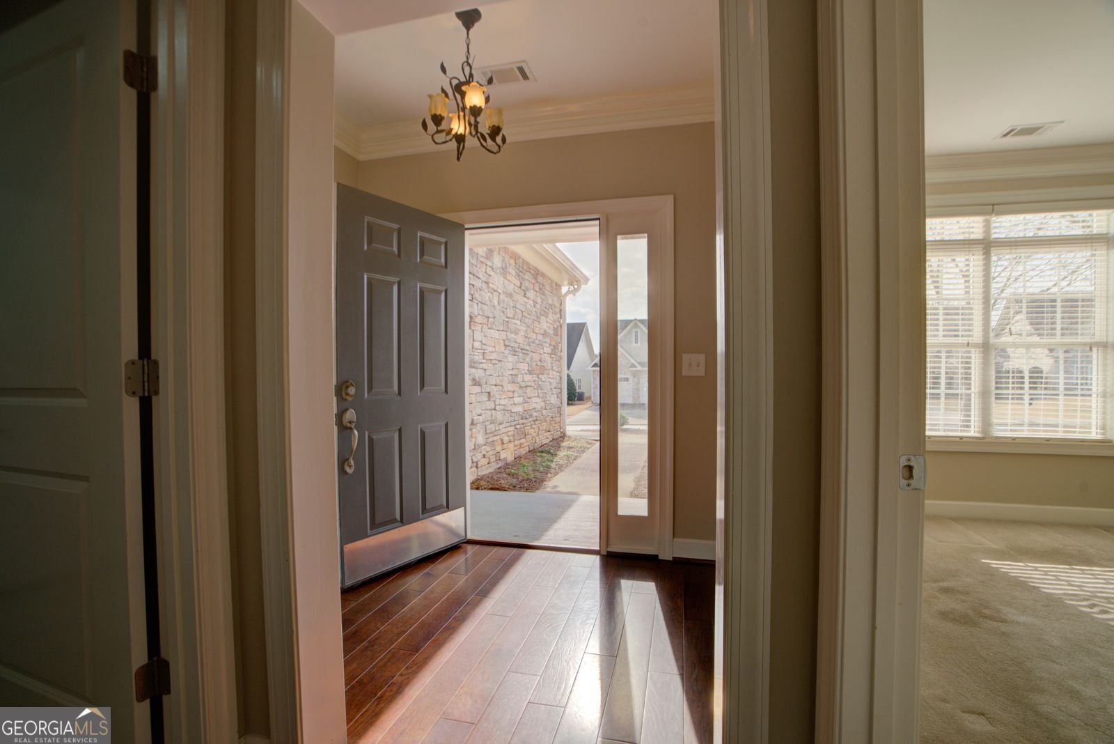 115 Carriage Way Southeast Rome, GA 30161 - Photo 6 of 39 a view of a hallway to a livingroom with furniture