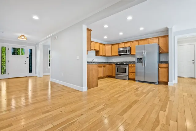 a view of a kitchen with a sink and cabinets
