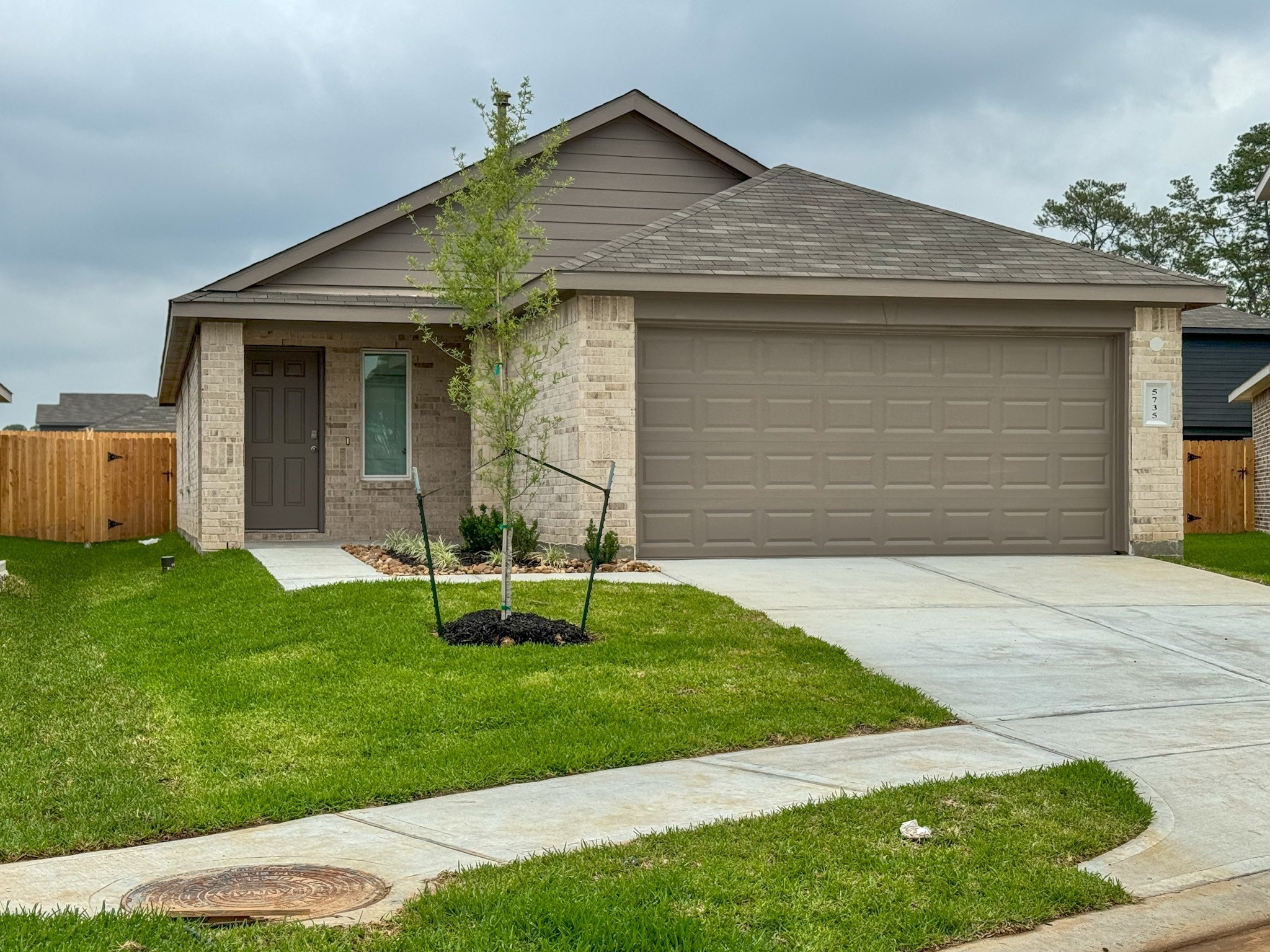 5735 Sycamore Glen Dr Spring Spring, TX 77373 - Photo 2 of 26 a front view of a house with a yard