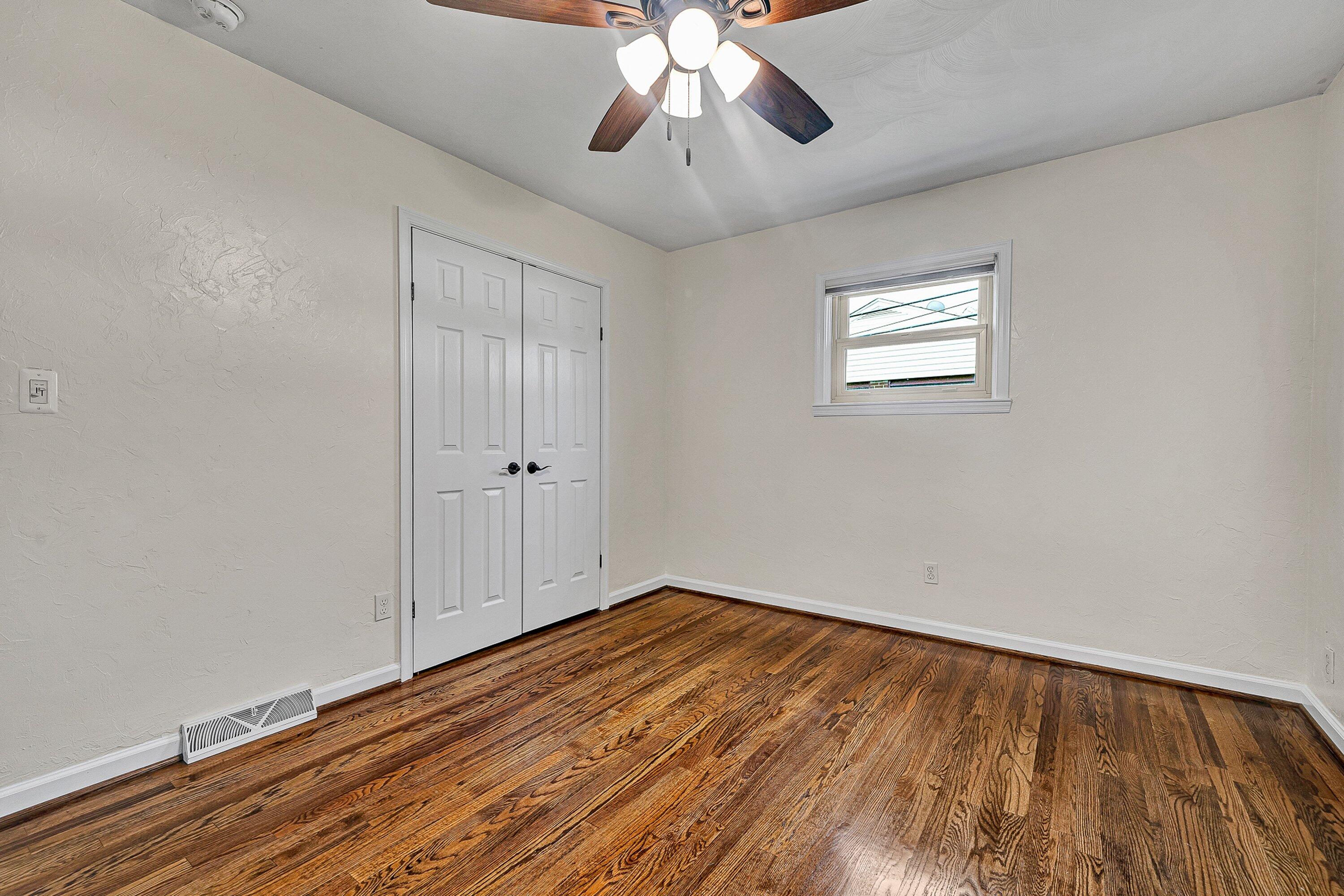 405 Diamond Road Salem, VA 24153 - Photo 13 of 28 wooden floor in an empty room with a window